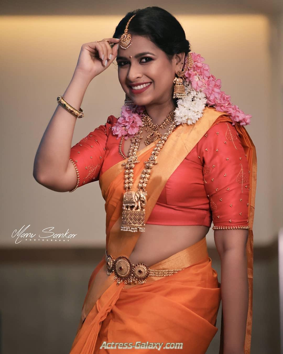 Sadhika Venugopal Hot Photos in Wedding Saree Side View